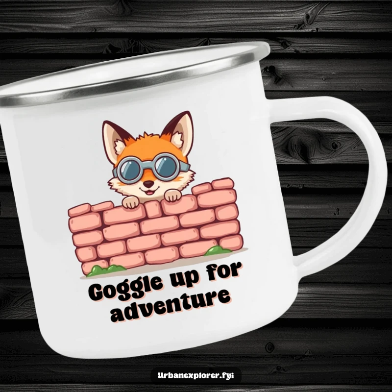 Funny fox camping mug, a small round fox wearing goggles, gleefully peeking from behind a crumbling brick wall, an outdoor cup.