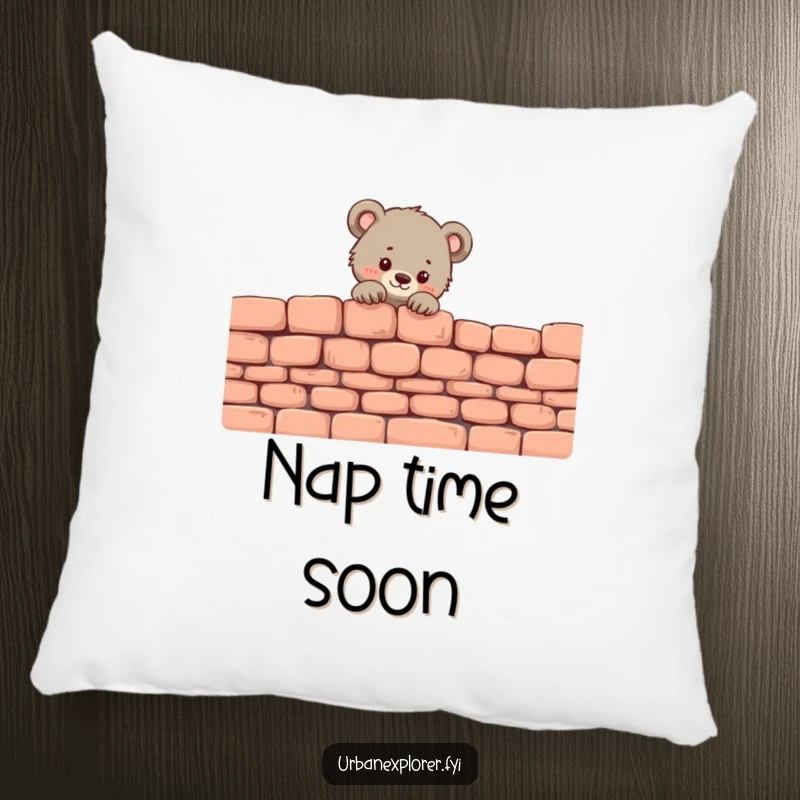 Funny Bear Cub Pillow: A tiny bear cub peeks over a brick wall, adding a touch of adorable charm.