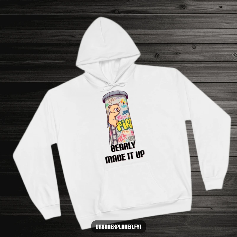 Funny Kawaii bear, driven and focused, climbing a vibrant, graffiti-laden water tower on this warm and funny hoodie. Adventure awaits.
