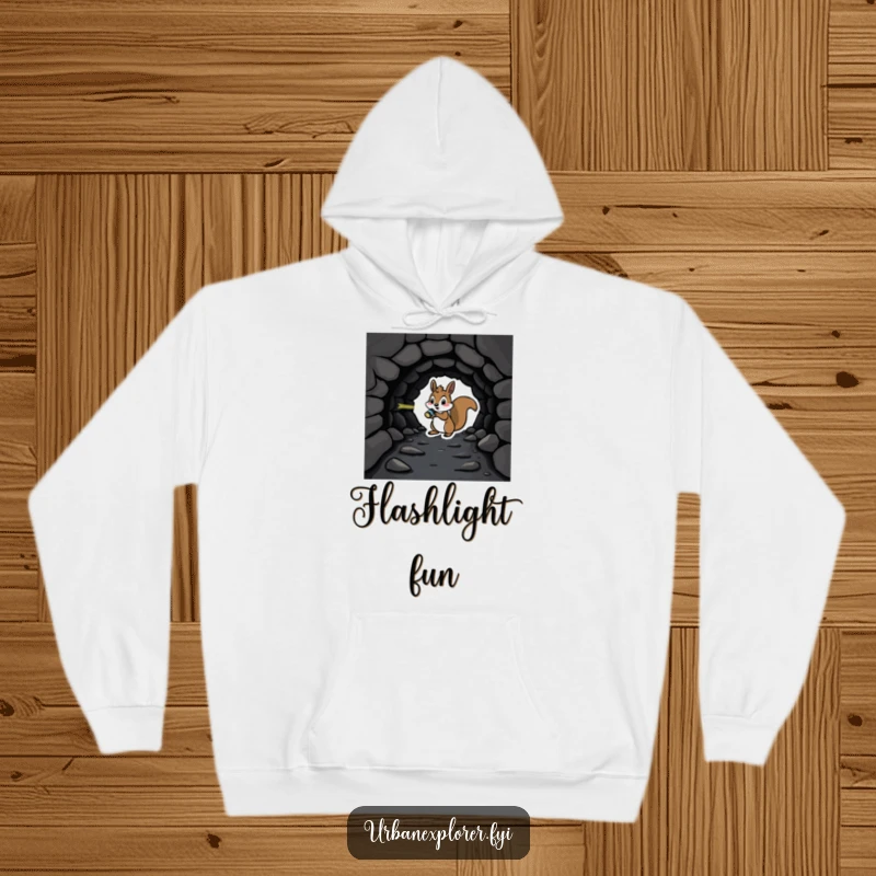 Playful squirrel with a flashlight investigating a dark tunnel, printed on a cozy and humorous hoodie.