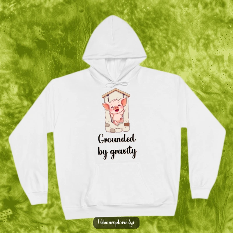 Funny hoodie depicting a joyful piglet rappelling down a facade, perfect for cozying up with a dose of humor.