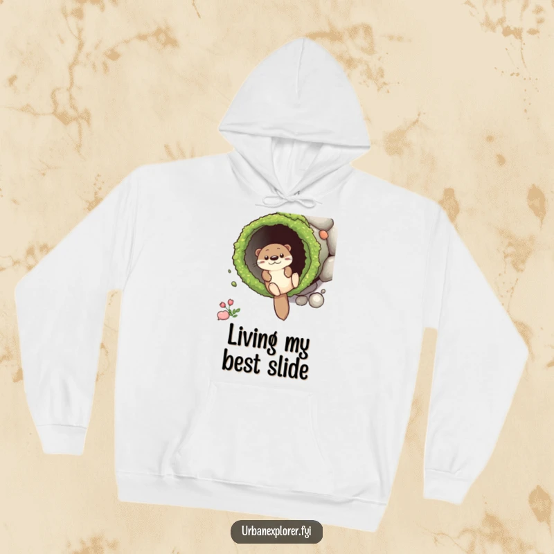 Funny Hoodie depicting a happy otter sliding down a mossy drainpipe, designed for ultimate comfort and a good dose of playful cheer.