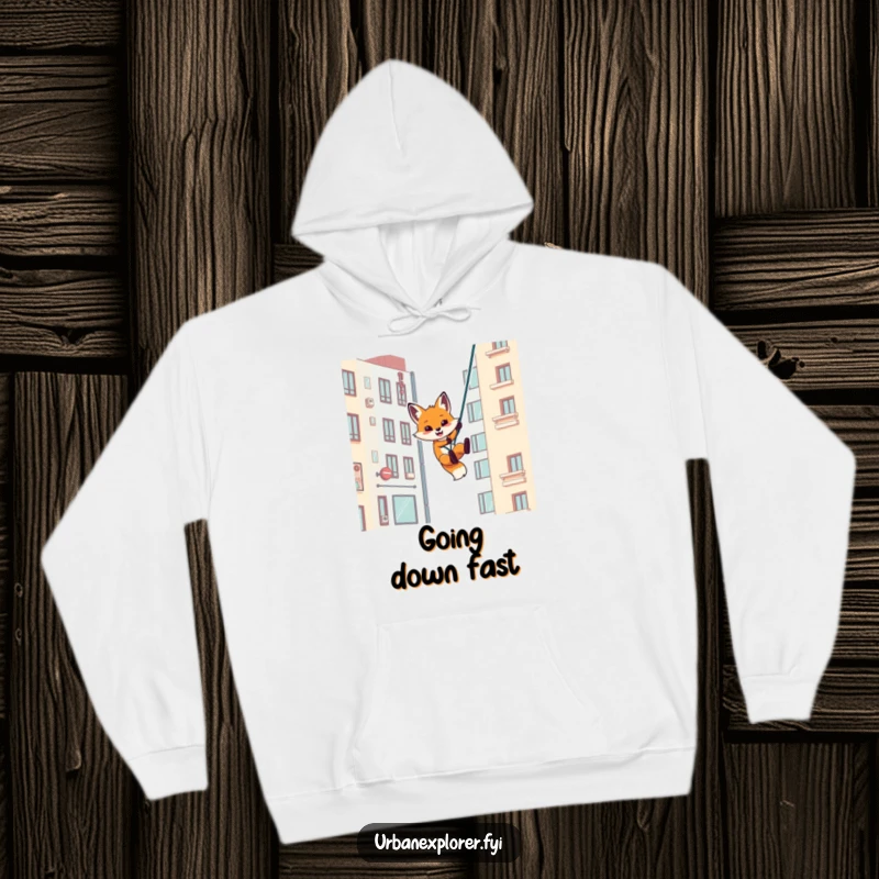Funny hoodie featuring a playful fox rappelling down an urban building, a cozy and humorous piece for adventurers.