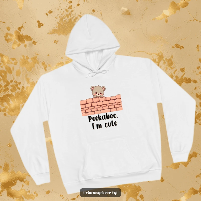 Funny Bear Cub Hoodie: A tiny bear cub peeks over a brick wall, radiating adorable curiosity.
