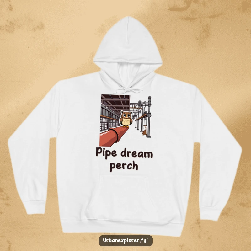 Cheerful owl perched on a rusty pipe in an industrial complex, printed on a cozy and humorous hoodie.