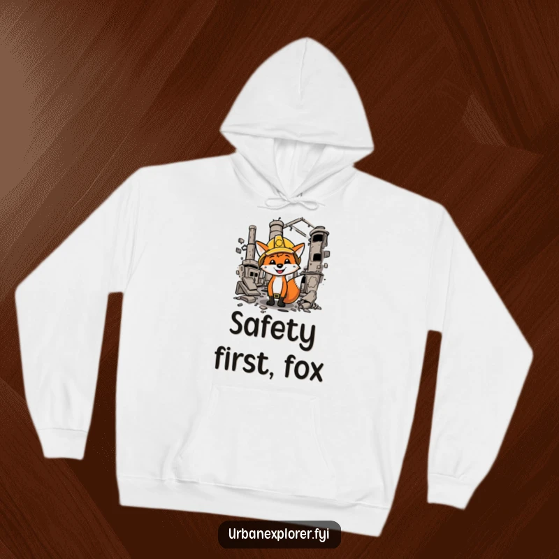 Funny fox wearing a hard hat, exploring a dilapidated factory, featured on a cozy and humorous hoodie.