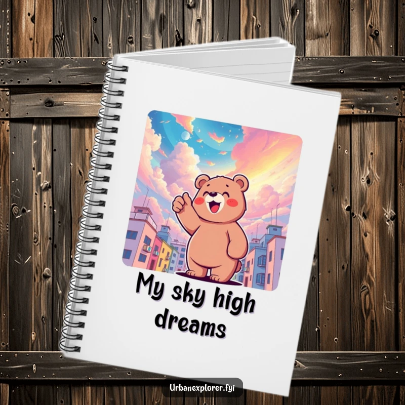 Funny bear character pointing upwards at a surreal, colorful sky above buildings, designed for journaling dreams, a funny gift notebook.
