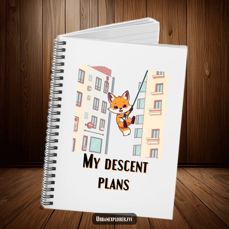 Funny notebook with a playful fox rappelling down an urban building, ideal for jotting down urban adventures.